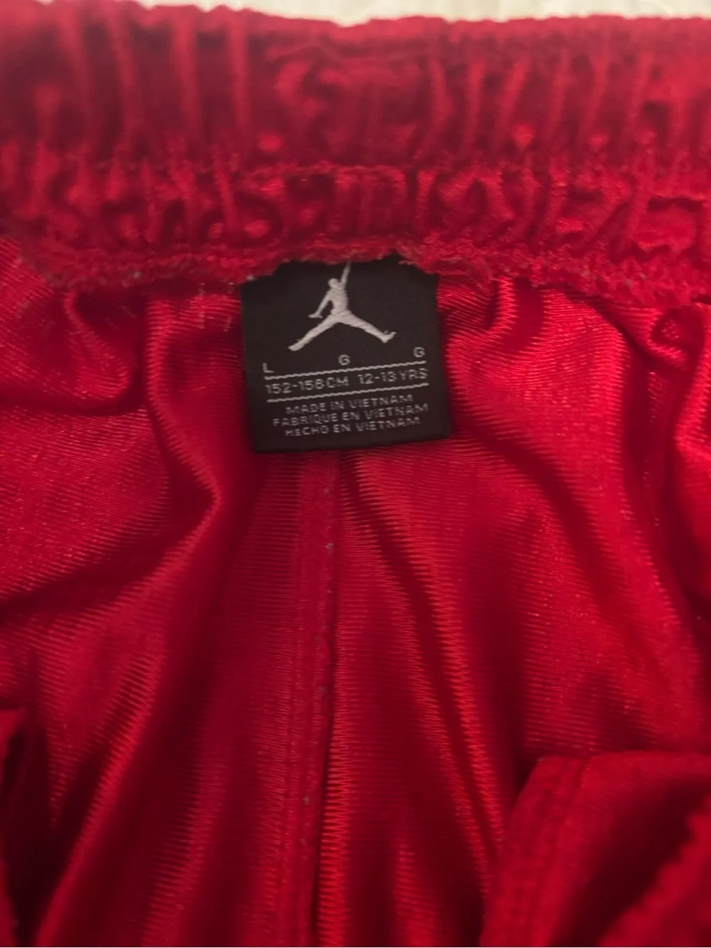 Jordan Boy’s Red Mesh Athletic Basketball Shorts with White Jumpman size L